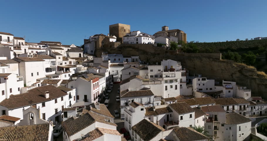 Setenil de las Bodegas Whitewashed Houses Built Into The Surrounding Cliffs In Cádiz, Southern Spain. Aerial Drone Shot