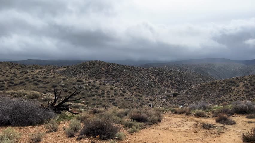Slow pan over the desertous mountains and foliage deep in the Hesperia Desert, California near Deep Creek and the Pacific Crest Trail