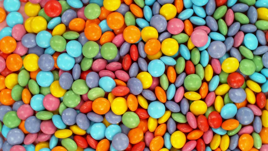 Super slow motion of flying candies up in the air. Camera in super fast motion. Filmed on high speed cinema camera, 1000 fps, placed on high speed cine bot.