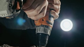 Stone cutting art. Media. Isolated on a dark background. The hands of the master with a power tool with a cutter are processing the sculpture - Powered by Shutterstock - Get 15% off with code: PIKWIZARD15