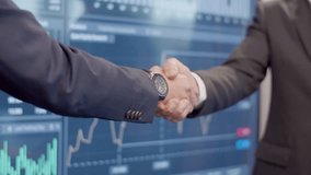 Data engineer shaking hands in meeting room. Business people in official suits making successful deal after analyzing big data on digital screen. Business, communication - Powered by Shutterstock - Get 15% off with code: PIKWIZARD15