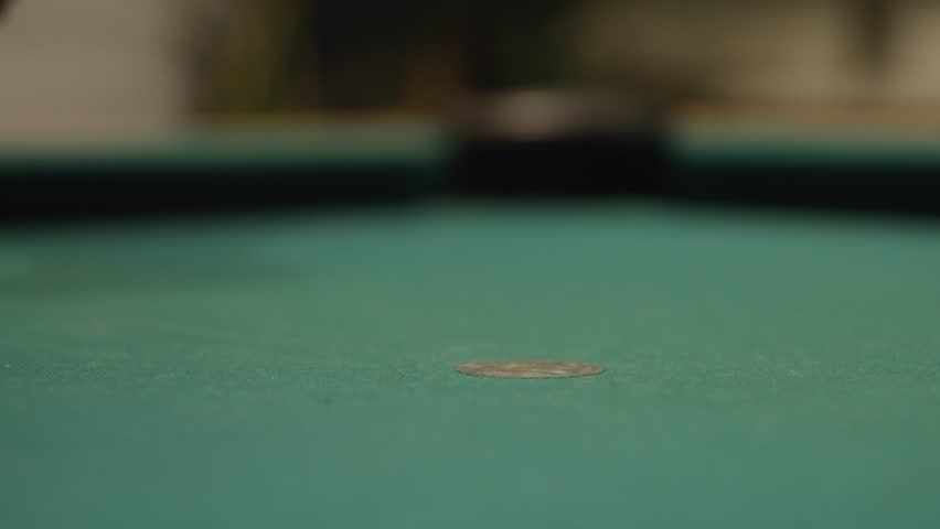 Slow-mo, placing a white cue ball into a clean pool table and hitting the white cue ball with a pool cue stick, close-up shot from table level | Shutterstock HD Video #1099530157