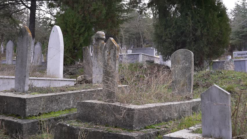 Graveyard and tombstones in autumn
 | Shutterstock HD Video #1099540687