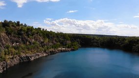 Lake in an abandoned quarry with blue water in Dnipro in Ukraine