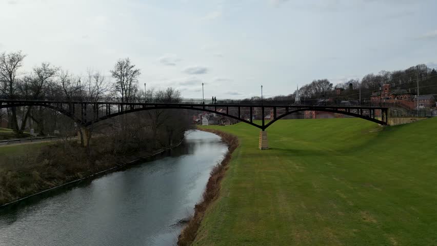 Flying under the iconic Grant Park Pedestrian Bridge with the historic township of Galena, Illinois on the right.