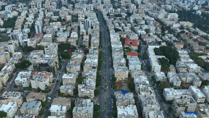 Givatayim , Israel- aerial view time lapse of a main street and city traffic. Royalty-Free Stock Footage #1099545903