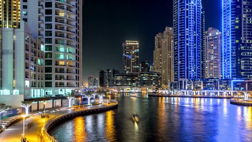View of Dubai marina towers and canal in Dubai night timelapse , hyperlapse  | Shutterstock HD Video #1099548199