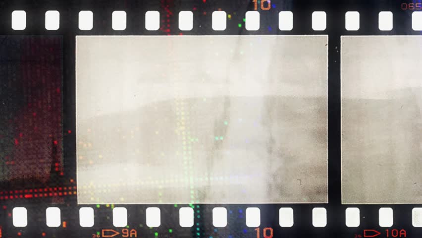 moving or animated 35mm film strip with luma mask, real scan of film material with cool scanning light interferences on the material. cool video transition, HD Footage.