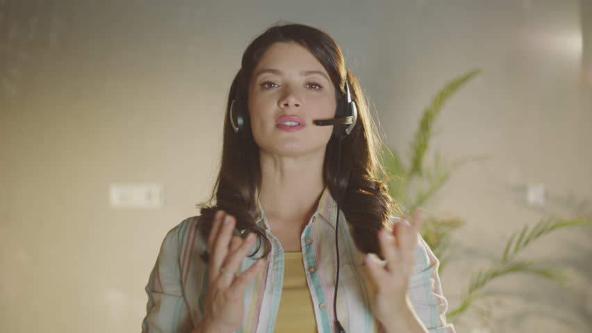 Beautiful young call center girl having business call in the office | Shutterstock HD Video #1099551321