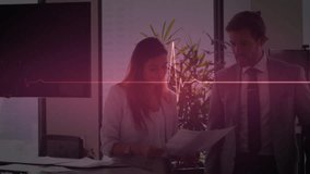 Animation of heart rate monitor over businessman and businesswoman discussing over document. Medical research and business technology concept - Powered by Shutterstock - Get 15% off with code: PIKWIZARD15