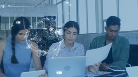 Animation of numbers, rotating globe over diverse coworkers working over digital tablet and laptop. Digital composite, multiple exposure, globalization, teamwork, abstract and technology concept. - Powered by Shutterstock - Get 15% off with code: PIKWIZARD15