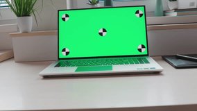 Close-up of laptop screen with green background. Copy space and mock up. Zoom in. First sight view. Concept of videocall and remote online work.