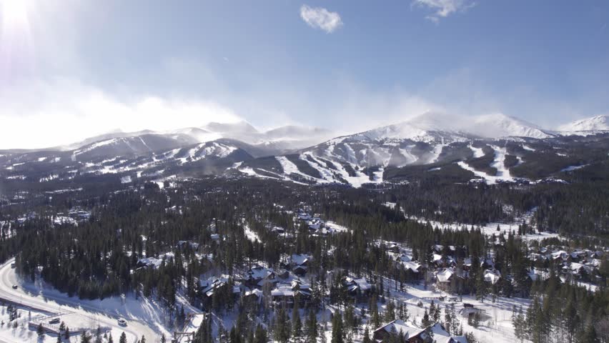Silverthorne, Colorado Forest and Rocky Mountains. Daytime. Aerial Drone Footage. Ascending.