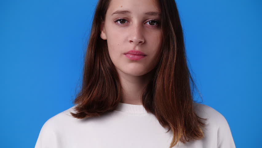 4k video of one girl with negative facial expression.