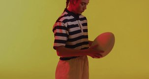 Animation of neon pattern over female rugby player on neon background. Sports and communication concept digitally generated video.