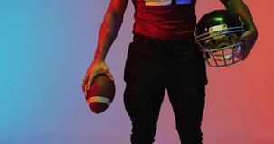 Animation of you win text over american football player and neon triangles. Sports and communication concept digitally generated video.