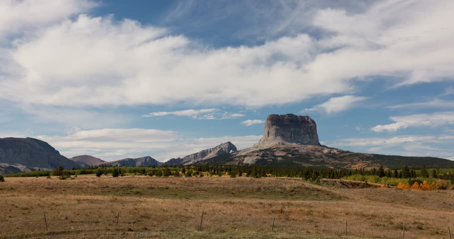 Autumn in Glacier National Park Montanan with clouds moving past Chief Mountain