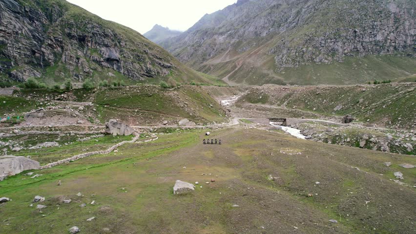 aerial of motorcyclists in extreme mountain landscape of northern Himalaya Mountains in India