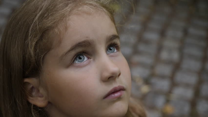Kid Looking Up at Sky in Nature. Portrait Little Girl Praying Looking Up at Sky With Hope and Faith, Contemplative Child Face, Closeup. Girl Looks-up God Believer Prayer, Passionate Dreamer Divine.