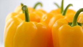 Yellow pepper close up, rotating on grey background. Vegan vegetable sweet organic bell peppers backdrop. Fresh sweet organic bell pepper close up, slow motion.  - Powered by Shutterstock - Get 15% off with code: PIKWIZARD15