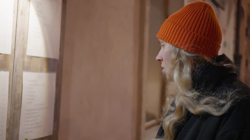 A woman, stands on the street on New Year