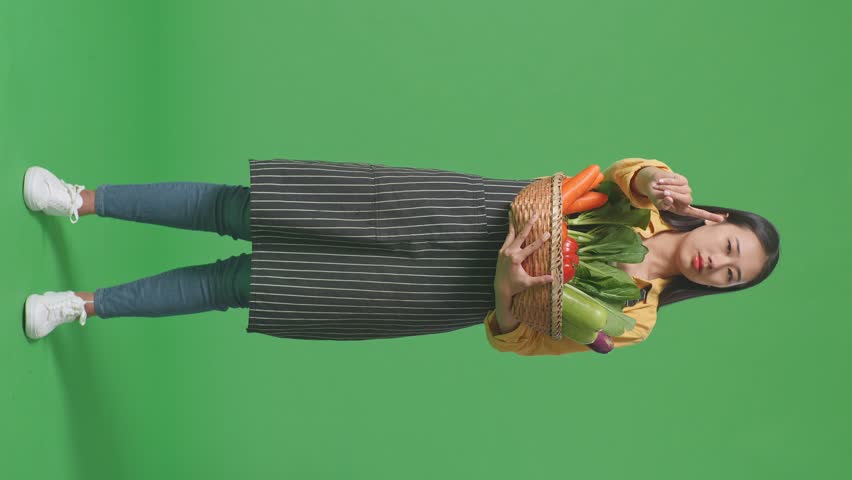 Full Body Of Asian Female Farmer With Vegetable Basket Showing Stop, One Finger Gesture, Taboo Sign, Standing On Green Screen In The Studio
 | Shutterstock HD Video #1099588309