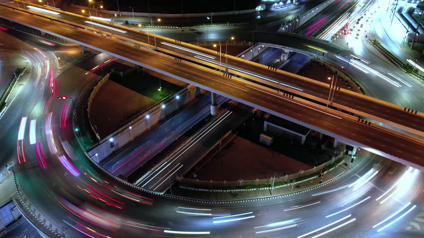Traffic an important infrastructure, financial technology, Expressway top view, traffic transportation above intersection road in city night sky aerial view cityscape of advanced innovation,Hyperlapse Royalty-Free Stock Footage #1099588581