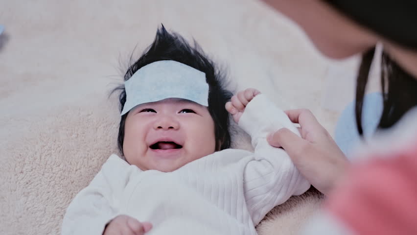 Asian baby moms also tributes to gellings, draining their comforts, smiling, cute, bright. | Shutterstock HD Video #1099590473
