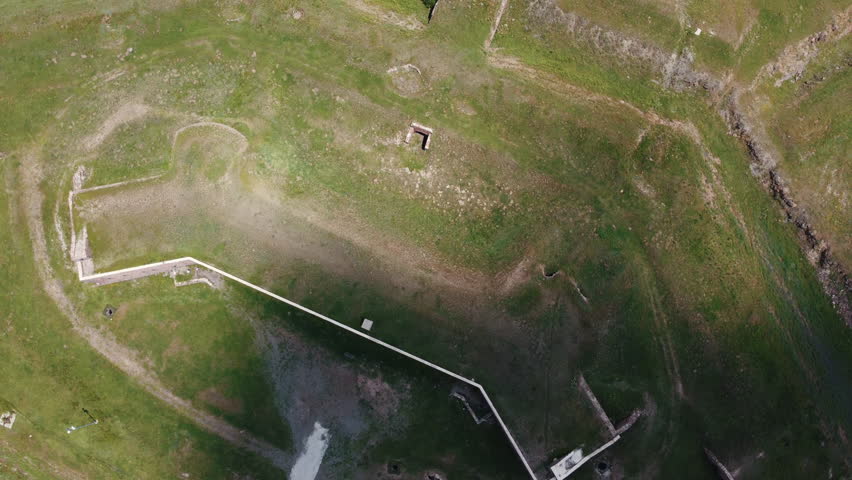 Ottoman empire defense lines. It is a historical and military building. It is found in Turkey and the city of Erzurum. It is a high altitude city and cloud movement can be seen.