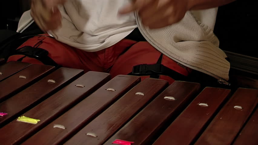 Xylophone Player, Male Musician Playing a Xylophone, Wooden Bars of a Xylophone Being Struck by Mallets. Close Up.