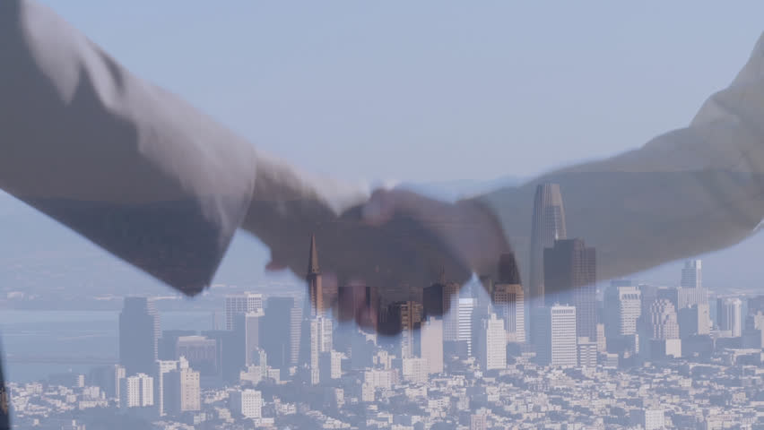 Composite video of businessman and businesswoman shaking hands against aerial view of cityscape. Business technology concept | Shutterstock HD Video #1099601075