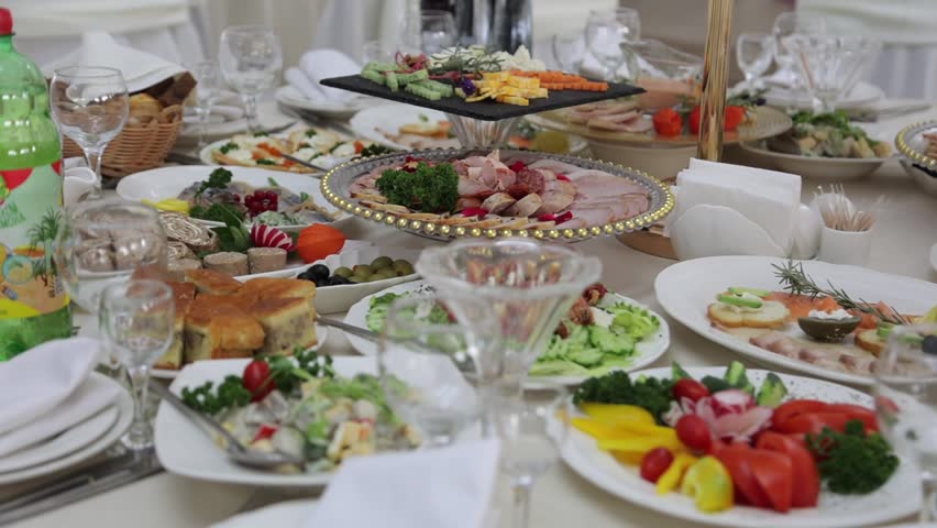 Festive table with delicious dishes. A large selection of dishes, whets the appetite. Wedding in Ukraine | Shutterstock HD Video #1099603237