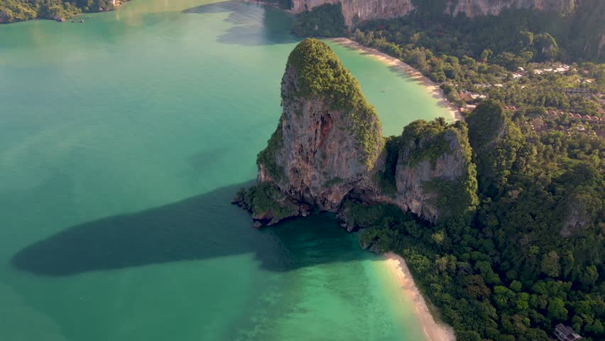 Aerial drone view of the limestone cliffs and tropical beach of Railay Beach Krabi Thailand.  | Shutterstock HD Video #1099607471