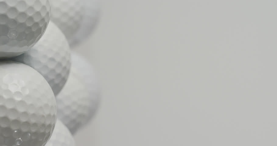 Vertical viedo of golf balls on white background, copy space, slow motion. Golf, sport and hobby concept. | Shutterstock HD Video #1099607957