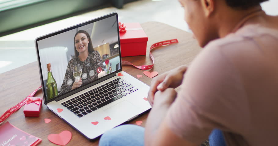 Happy caucasian woman with champagne making valentine's day video call on laptop. valentine's day celebration, romance and communication technology. | Shutterstock HD Video #1099611781