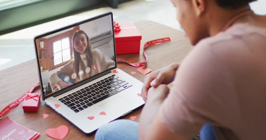 Happy caucasian woman waving and making valentine's day video call on laptop. valentine's day celebration, romance and communication technology. | Shutterstock HD Video #1099611863