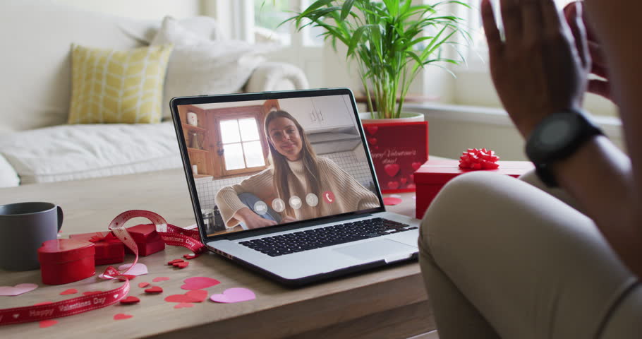 Happy caucasian woman waving and making valentine's day video call on laptop. valentine's day celebration, lgbtqi,romance and communication technology. | Shutterstock HD Video #1099612239