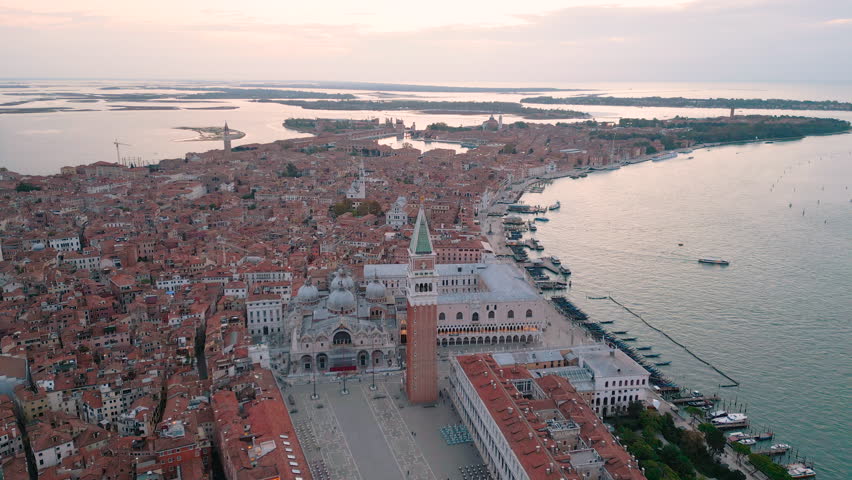 Aerial drone video of Venice panoramic landmark, aerial view of Piazza San Marco or st Mark square, Campanile and Ducale or Doge Palace. Italy,