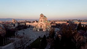 Sofia, Bulgaria, november 2021. The full moon rises over St. Alexander Nevsky Cathedral as the bells toll festively.