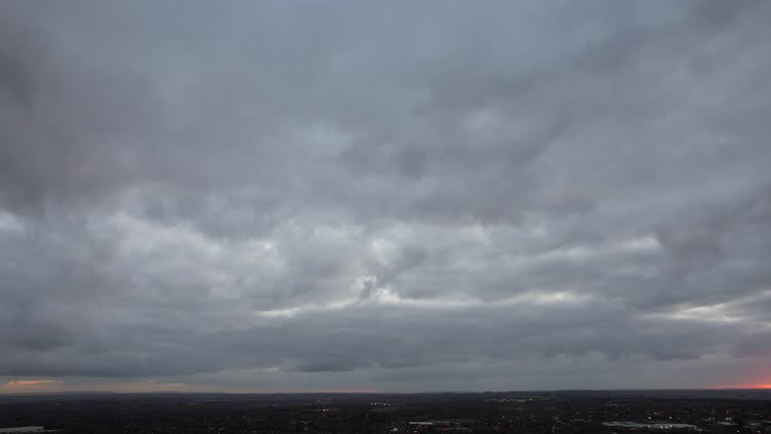 High Angle Footage of Dramatical Clouds and Sky During Sunset over Milton Keynes City of England UK