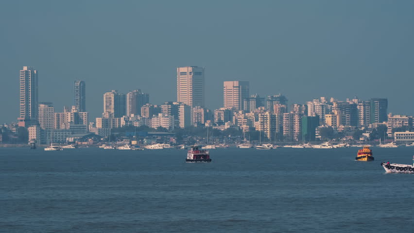 Mumbai skyline view and boats as seen from the Mumbai Harbour in Mumbai, India