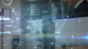 Network of connections and data processing against two caucasian businessmen using digital tablet. global networking and business technology concept - Powered by Shutterstock - Get 15% off with code: PIKWIZARD15