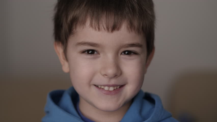Pretty Caucasian Preschool Boy. Portrait Little Smiling Boy Looking at Camera. Laughs Happily Child at Home Close-up. Inquisitive Little Kid Boy Portrait. Face Funny Contemplative Kid Child.  | Shutterstock HD Video #1099626469