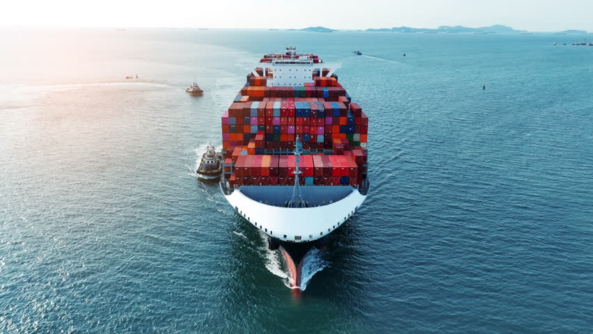 Aerial front view of smart cargo ship carrying container and running very fast for export cargo from container yard port to custom ,Contrail line in the ocean by large ship Royalty-Free Stock Footage #1099633271