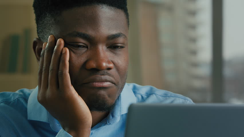 Bored tired exhausted businessman african american man adult sick ill napping office employee work online on computer monotone boring job lack of motivation laziness health problem fatigue need sleep Royalty-Free Stock Footage #1099633841