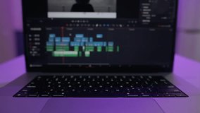 Timelapse of the editor's work on a laptop at home. Creates a creative video clip for film production. The interface of the program for video color correction. Postproduction in a home video studio