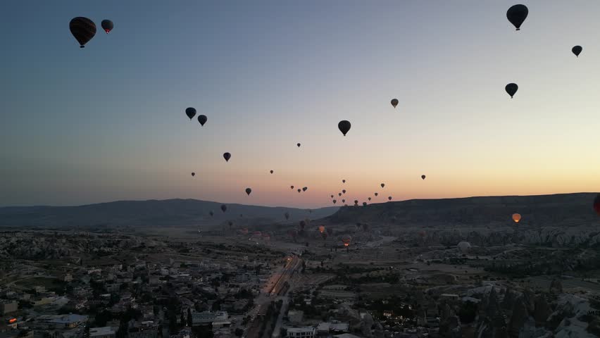 Incredible sunrise and balloons over the hills in Cappadocia. The view from the drone.