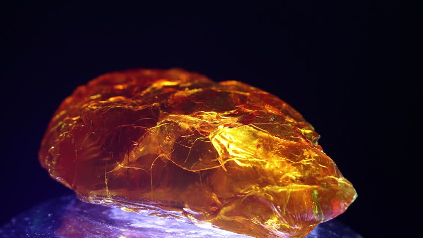 huge piece of amber, glows and flickers in different colors Royalty-Free Stock Footage #1099643953