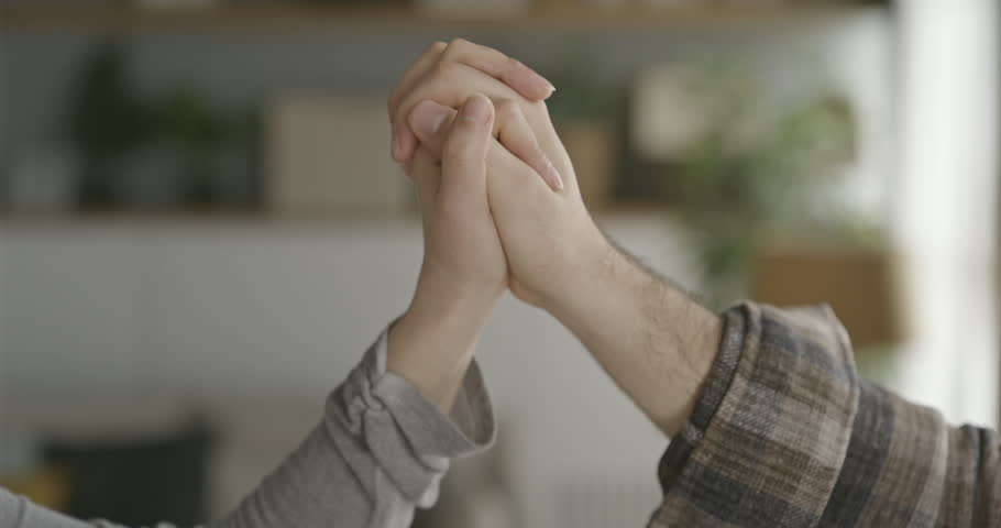 Man and woman hold hands | Shutterstock HD Video #1099646475