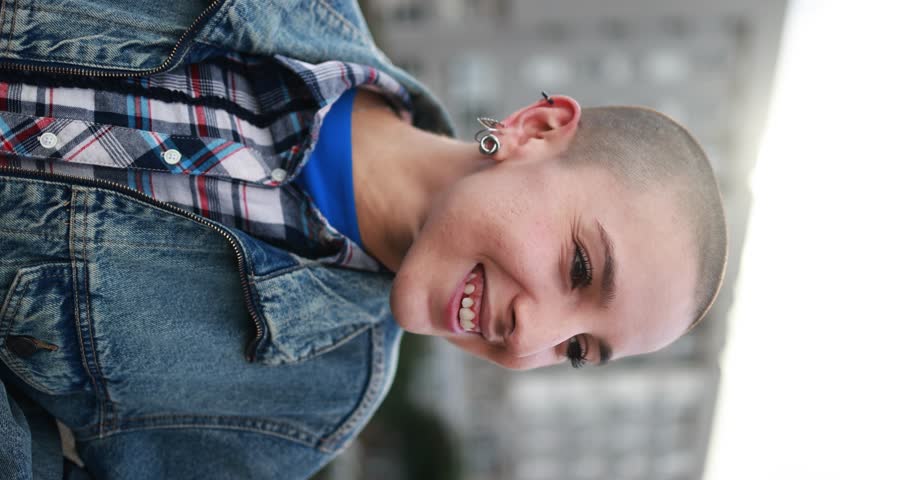 Young bald woman smiling outdoor - Vertical video | Shutterstock HD Video #1099647275